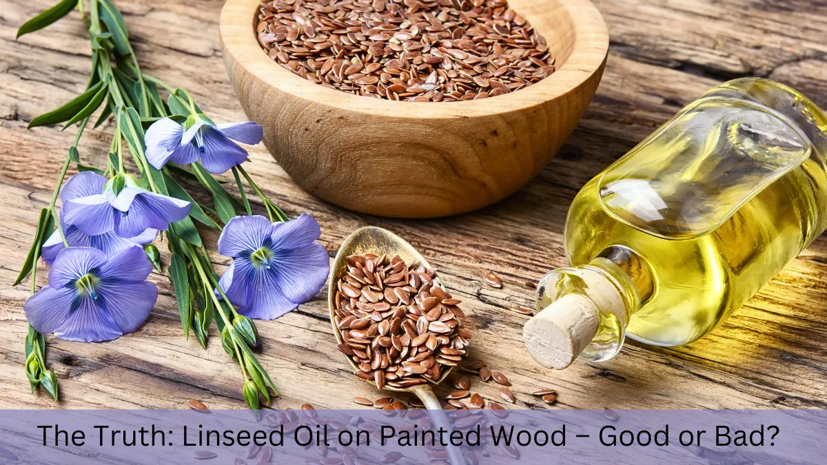 The image showcases a wooden surface with a wooden bowl filled with linseed seeds, a spoon holding more seeds, and a glass bottle filled with linseed oil. Beautiful blue flax flowers, which are the source of linseed, are placed next to the bowl. The text at the bottom reads, "The Truth: Linseed Oil on Painted Wood – Good or Bad?" This visually represents the natural origin of linseed oil. The focus keyword "can you use linseed oil over painted wood" ties into the article's theme of evaluating linseed oil's effects on painted surfaces.